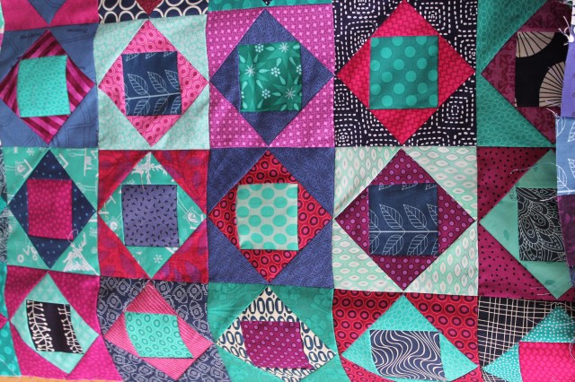 paper pieced square in square modern  scrap quilt