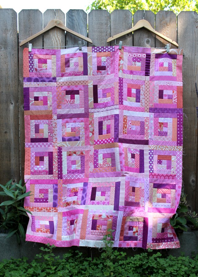modern scrap log cabin quilt top