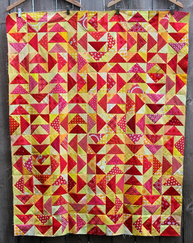 modern scrap flying geese quilt