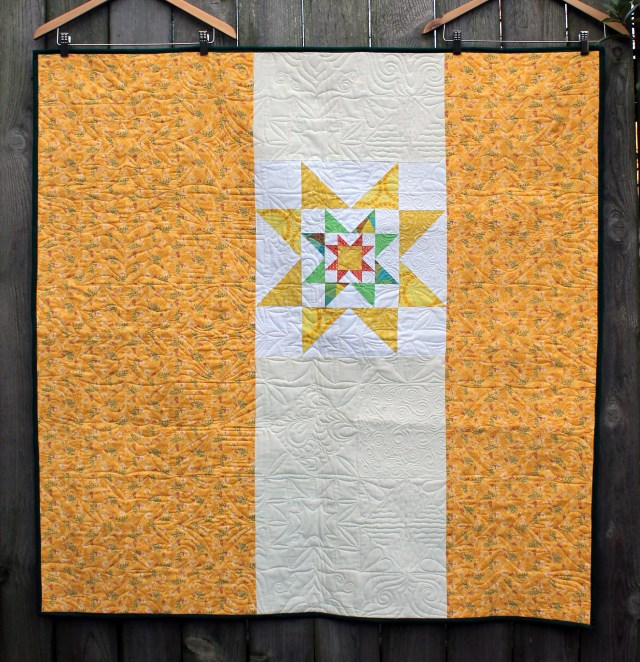 back of green yellow star quilt