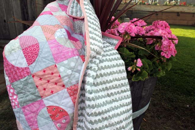 quilt and potted plant